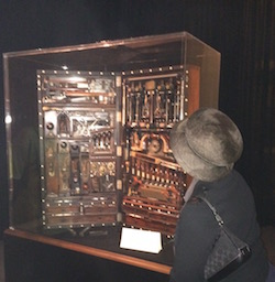 Shirley J examining the  Studley chest on display at the Masonic Temple during Handworks in Iowa