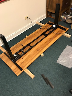 Fitting the base to underside of desk after panel glue up and finishing