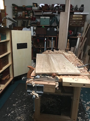 Wood shavings covering the shop at the end of the workday.