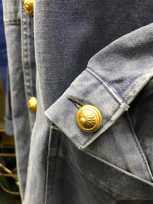New metal button at cuff and placket