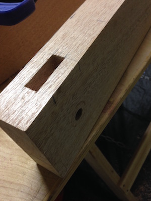 Mortise and acme screw drill hole lined up to cross perpendicularly inside the jaw.