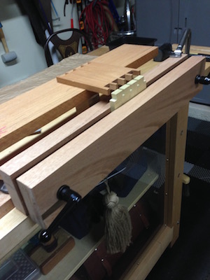 Moxon vise and sample piece of wood with cut dovetails