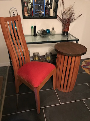 Slatback chair and slatted barrel table in a foyer