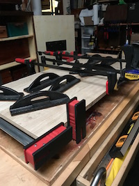 Glue up and clamping of pecan panels for standing table top