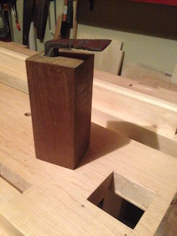 Ipe block with inserted bench hook before dropping into mortise.