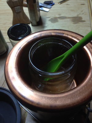 Heating the veneer hide glue in the copper glue pot.