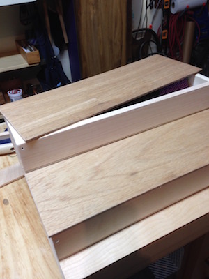 Completed wood boxes ready to veneer decorative vellum paper to lids.