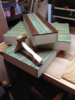 Veneer hammer and boxes decorated with vellum paper.