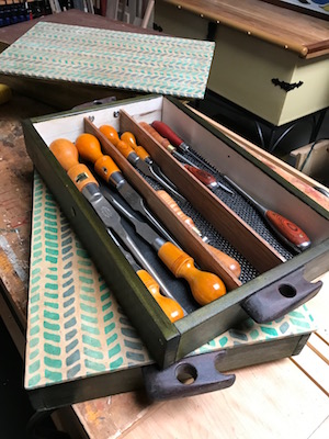 Stylish storage boxes with set of vintage screwdrivers.