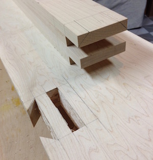 One of the laminated bench legs