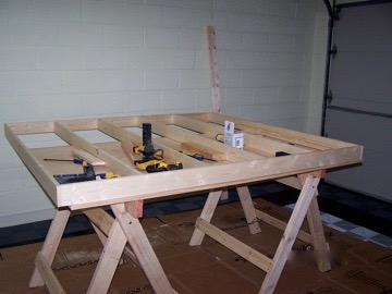 Vinyl album rack in progress on plywood table set on saw horses