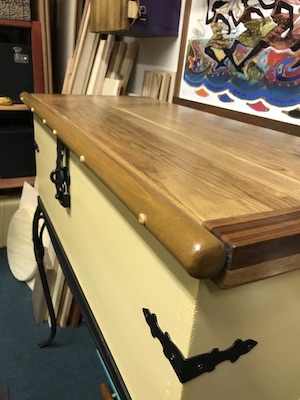 Close up of long view of lid and handle on completed Spanish style chest.