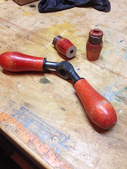 The grips of the saw vise being covered with old file handles.