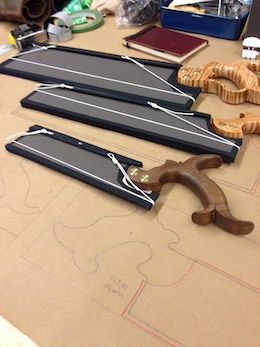 Dovetail saws in protective, acid free art board envelopes for going to class.