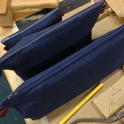 Three canvass bench plane tool pouches zipped up and ready to travel to class.