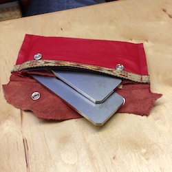 Extra plane blades in their own orange leather pouch.