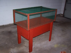 The container garden with with the smaller critter hutch covered in garden mesh wire.