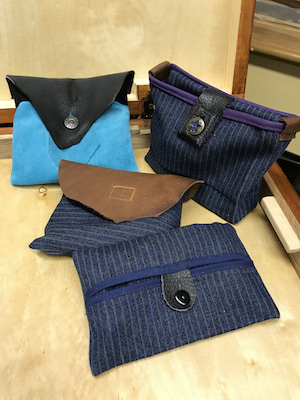 Leather and canvas sacks for accessories and small hardware.