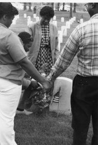 The family honoring our brother, son, and friend, C. Jones at soldiers cememtery.