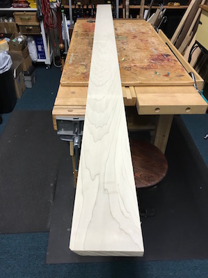 poplar wood board, 8 feet by 6 inches laid out on woodbench