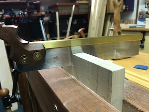 Cutting on lay out lines with a dovetail saw.