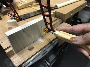 Fret saw cutting out joint waste.