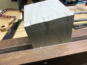 Completed dovetails with two tails and three pins.