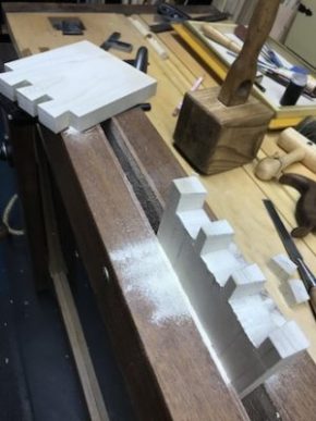 Completed tails and in-progress pins on moxon vise