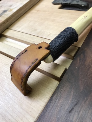 Dyed leather sheath and hook knife.