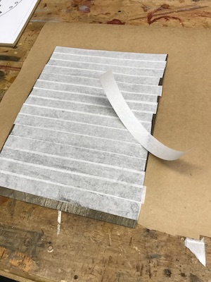 Veneer sheet covered with veneer tape.