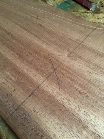 Mahogany plank marked for sawing.