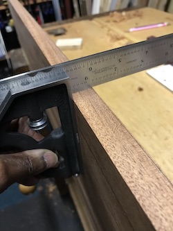 Checking jointed edge with a tri square.