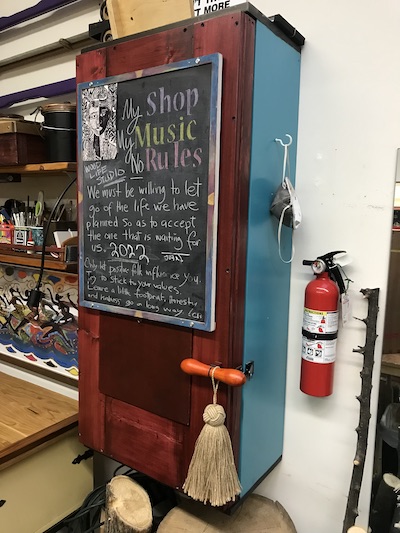 Closed saw cabinet in my wood shop protecting saw blade and teeth.