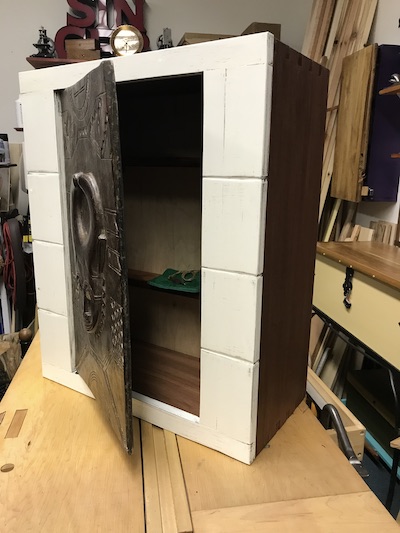 Finished altar cabinet with open door as symbol of accepting a dovetail challenge.