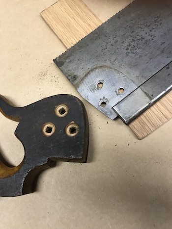 Handle and saw blade after taking them apart.