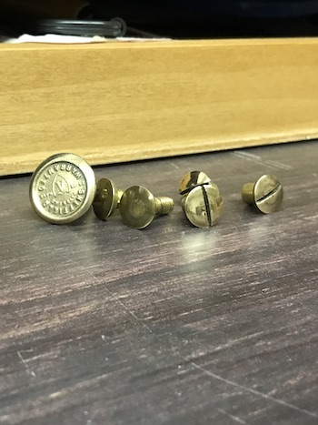 Saw nuts after restoration with metal polish.