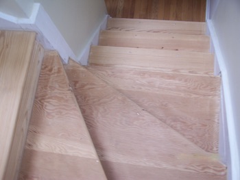 Completely sanded and cleaned wood stairs.