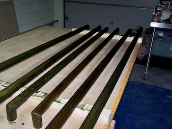 The dye stained handrails before installation on the walls.