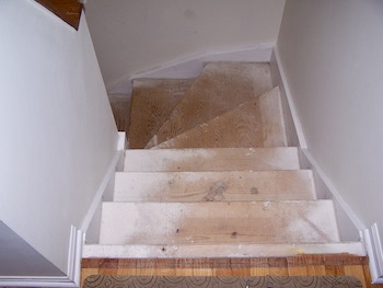 Over sprayed stairs after removal of the carpet tacks and staples.