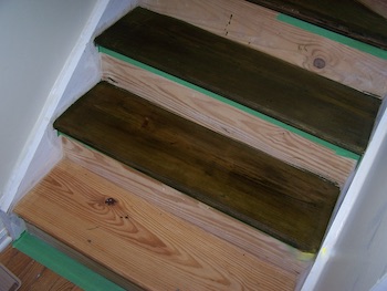 Stair treads staining in progress.