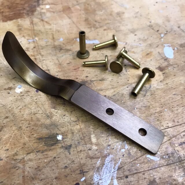 Hook knife kit with rivets.