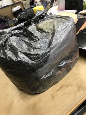Backpack liner rolled down.