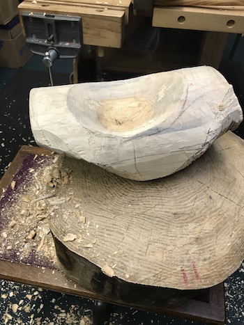 Shaping the log for finishing the bowl.