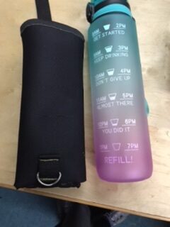 The water bottle with its personal pouch.