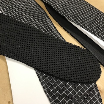 Black spacer mesh and Extreema fiber fabric.