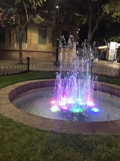 A colorful lighted fountain on the La Rambla promenade.