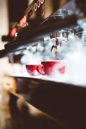 Steaming milk on a coffee maker.