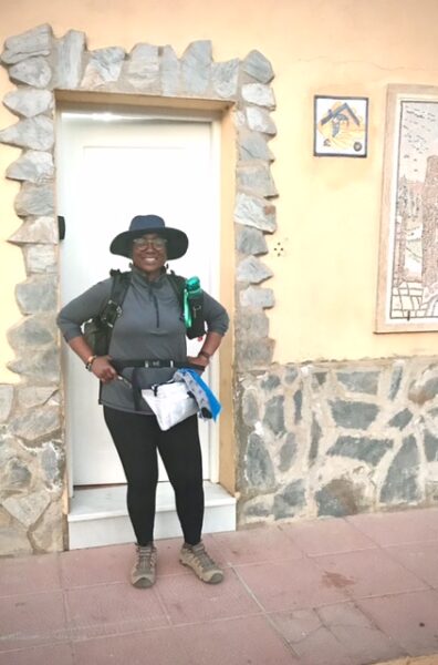 A pilgrim leaving the albergue and ready to begin another day's walk on the camino Mozarabe.