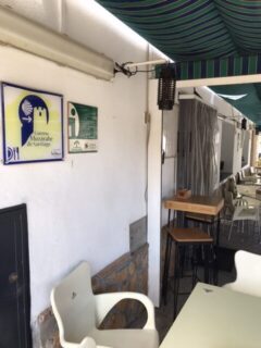 A cafe on the camino trail displaying signs and markers for pilgrims.