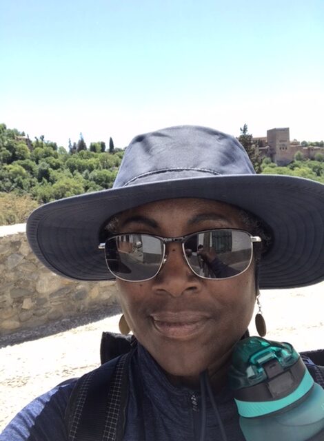 A tired and sweaty pilgrim on the camino on the Way to Granada, Spain.